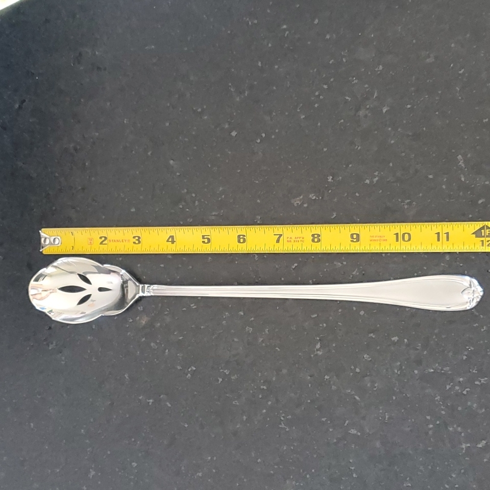 Scalloped, slotted serving spoon